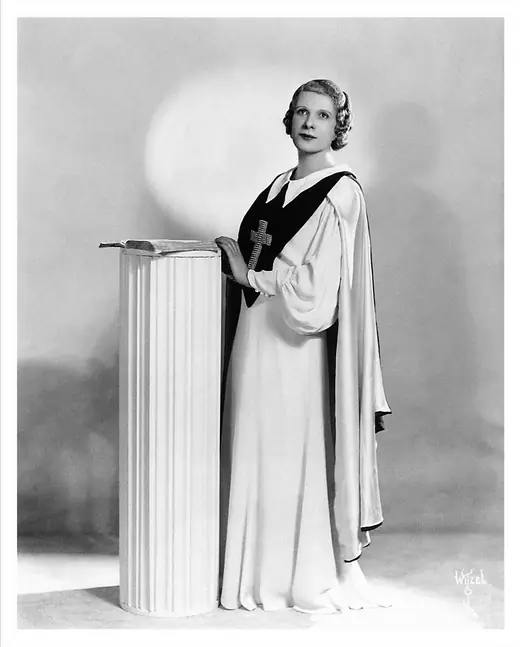 Formal studio portrait of Aimee Semple McPherson taken around 1922 by photographer Albert Witzel.