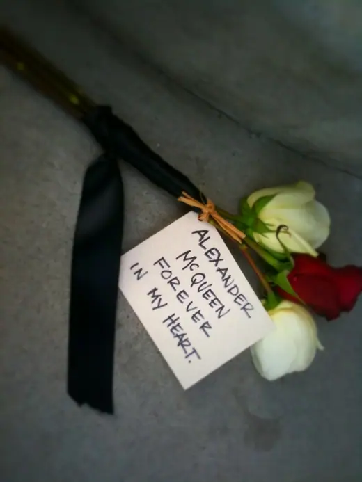 A single flower left outside the Alexander McQueen flagship store on the day of his death.