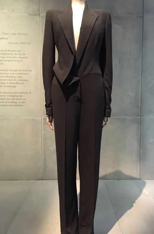 A black McQueen suit from Spring/Summer 1997 displayed at the Savage Beauty exhibition at the V&A, London.