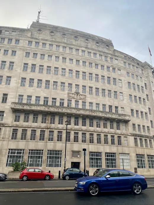 The curved Art Deco prow of BBC Broadcasting House rising above Portland Place in London.