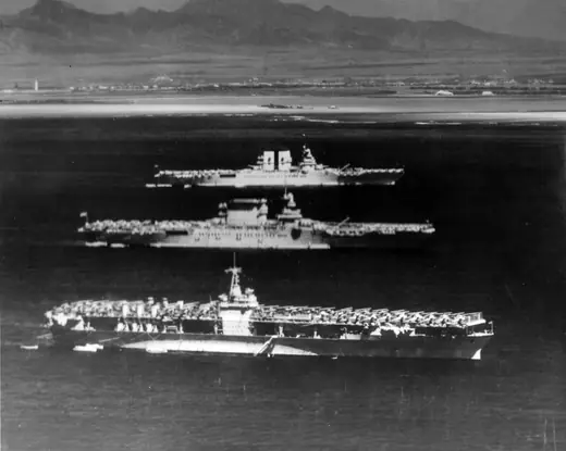 Three US Navy aircraft carriers at anchor off Honolulu in 1936, photographed from above.