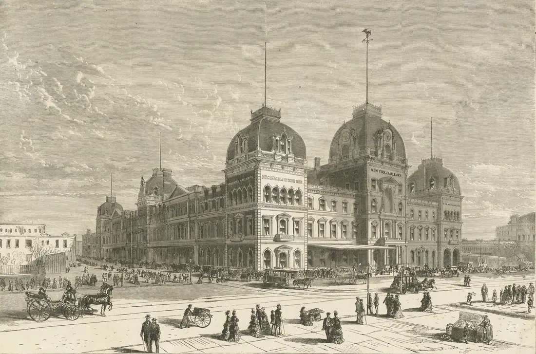 Interior of Grand Central Depot in New York, an iron-and-glass train shed with locomotives under the arch.
