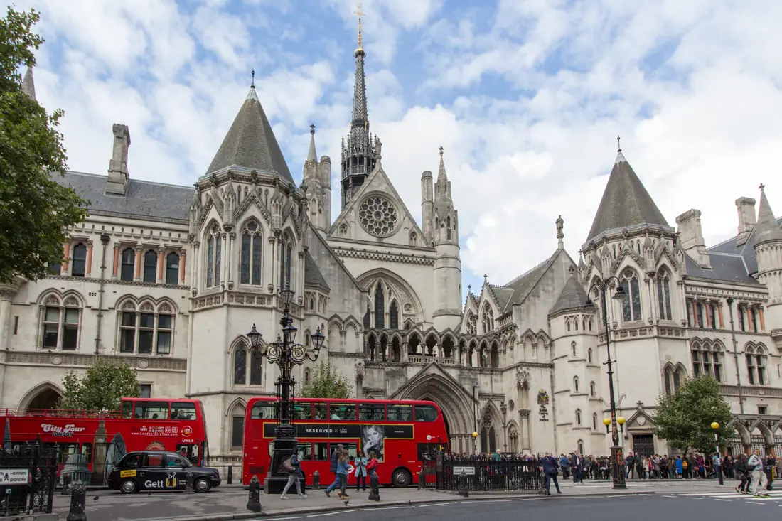 The Gothic Revival front facade of the Royal Courts of Justice on the Strand in London.