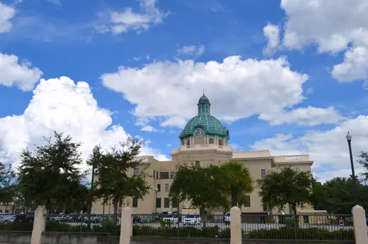 The historic Volusia County Courthouse in DeLand, Florida, a columned neoclassical building.