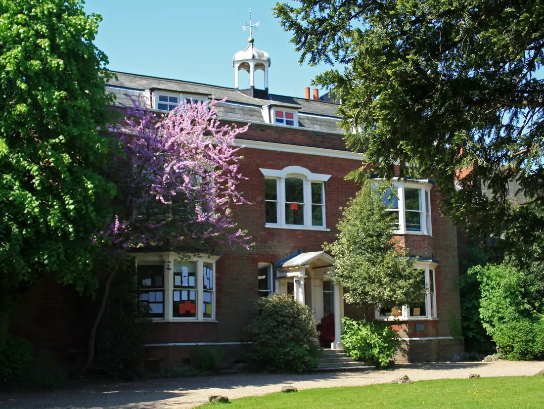 The red-brick front of Gad's Hill Place at Higham in Kent, with a cupola over the entrance.