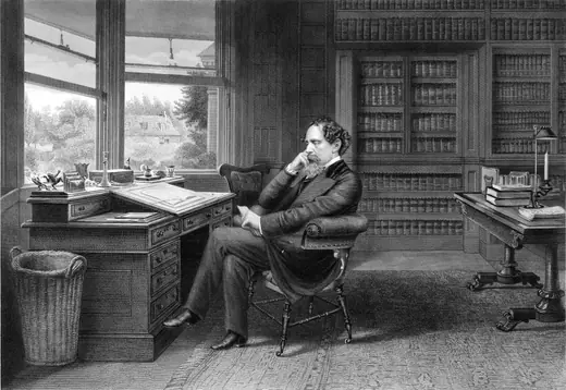 Engraving of Charles Dickens seated at his writing desk in the study at Gad's Hill.