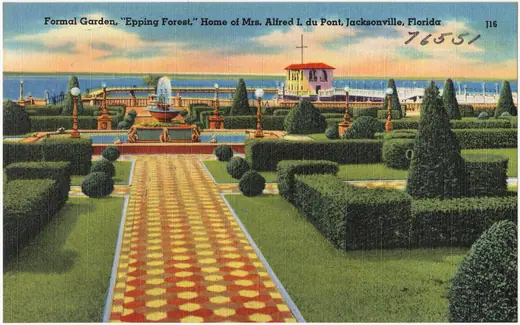 Colour postcard view of a clipped formal garden with hedges and a fountain in front of a large house.