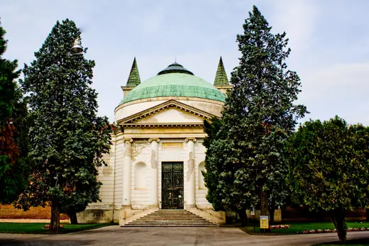 Rows of graves and cypress trees at the Cimitero Maggiore in Musocco, Milan.