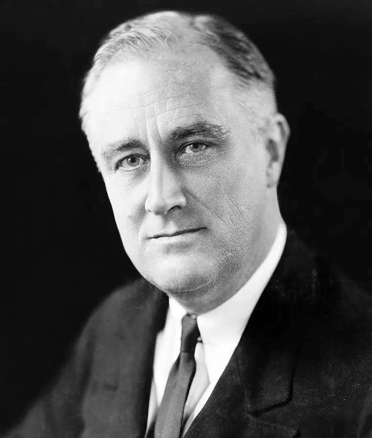 Studio photograph of Franklin D. Roosevelt in a dark suit, head turned slightly to his left, taken in 1933.