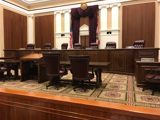 The courtroom of the Supreme Court of Florida, its bench and counsel tables empty.