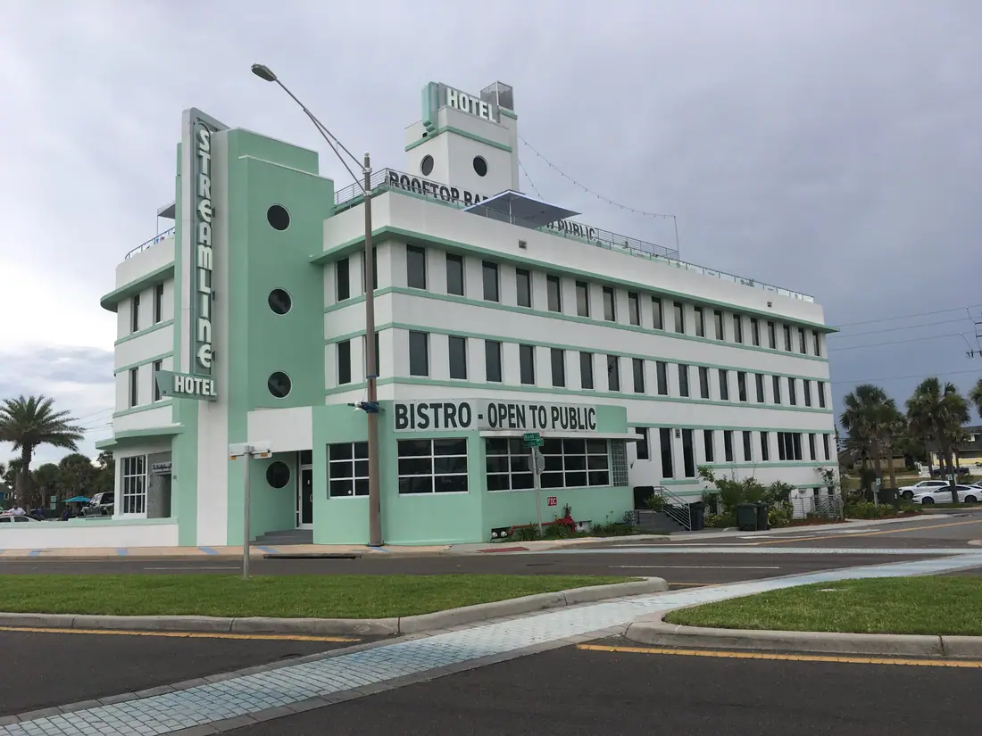 The Streamline Hotel, a white Art Deco building on the beachfront in Daytona Beach, Florida.