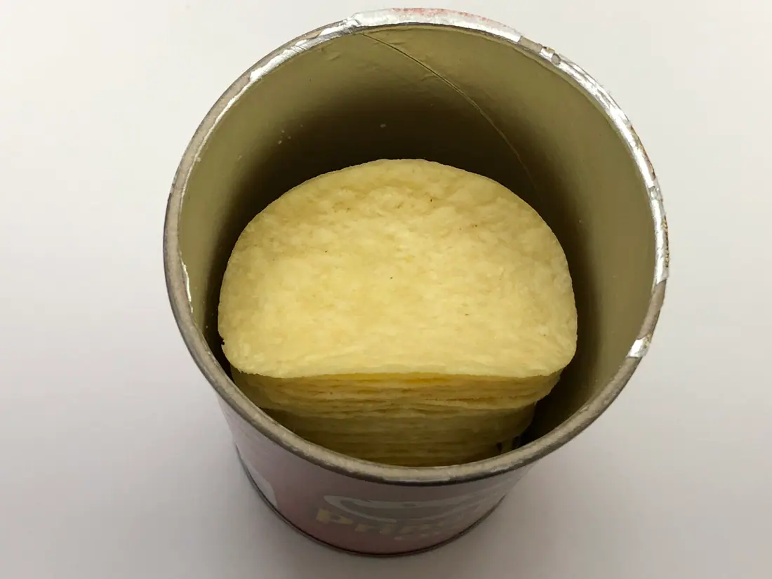 An open can of Original flavour Pringles.