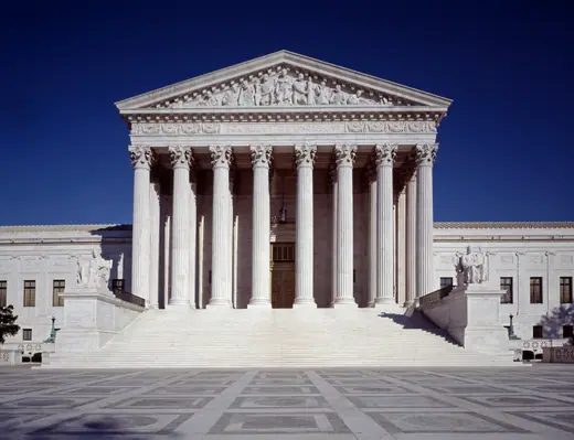 The marble west front of the United States Supreme Court building, with its columned portico and pediment.