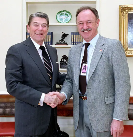 President Ronald Reagan shaking hands with Gene Hackman in the Oval Office, February 1987.