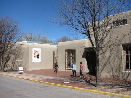 Adobe-style museum building in Santa Fe with the artist's name over the entrance.