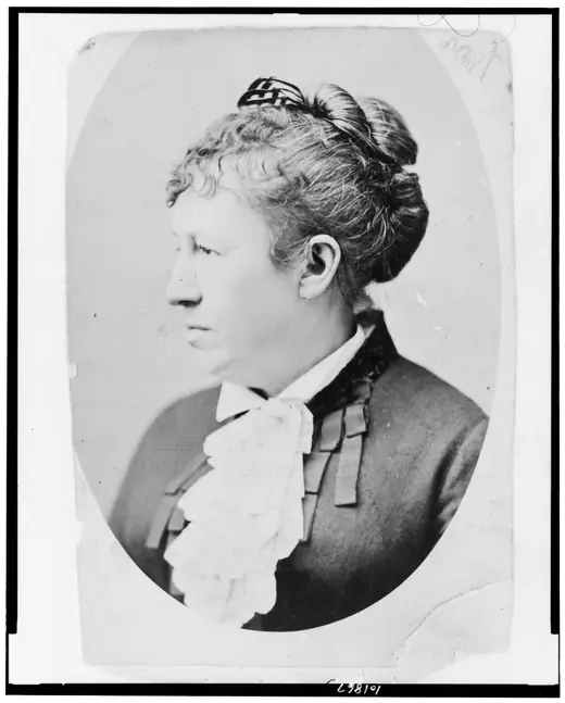 Head-and-shoulders photographic portrait of Julia Dent Grant, facing left, in a dark high-necked dress.