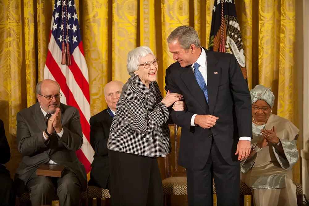 Harper Lee, seated, receiving the Presidential Medal of Freedom in the East Room of the White House.