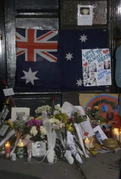 Flowers, candles and notes left on the pavement outside Heath Ledger's SoHo apartment building in New York.