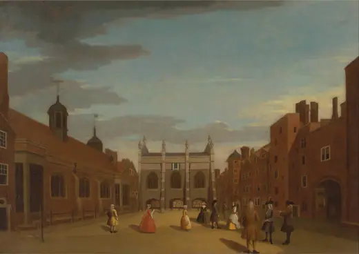 Oil painting of a brick Tudor hall and chapel behind railings, with small figures in eighteenth-century dress walking in the forecourt.