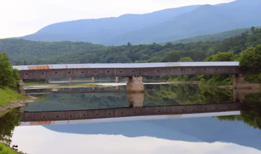 A long wooden covered bridge crossing the Connecticut River between Cornish, New Hampshire and Windsor, Vermont.