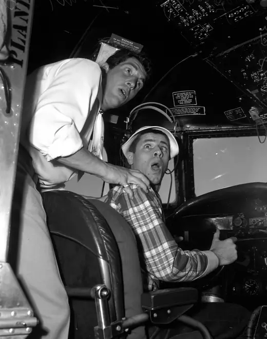 Two comedians clowning for a newspaper photographer around 1950.