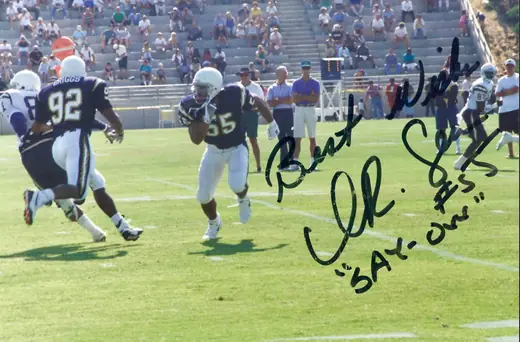 Junior Seau in a white throwback helmet at San Diego Chargers training camp in 1994.