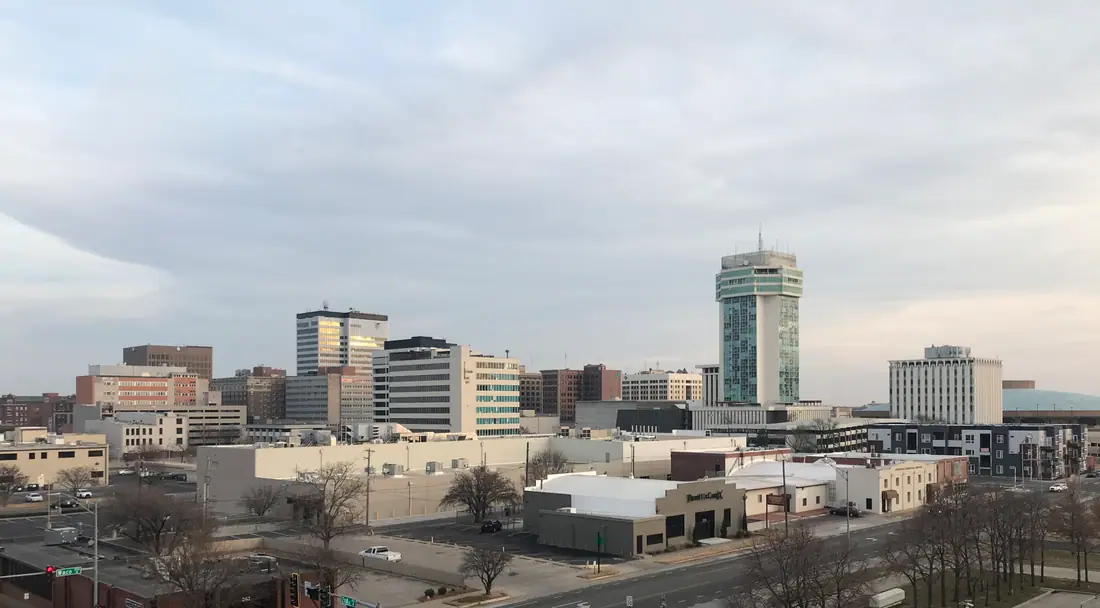 The Wichita, Kansas skyline photographed across the river at dusk.