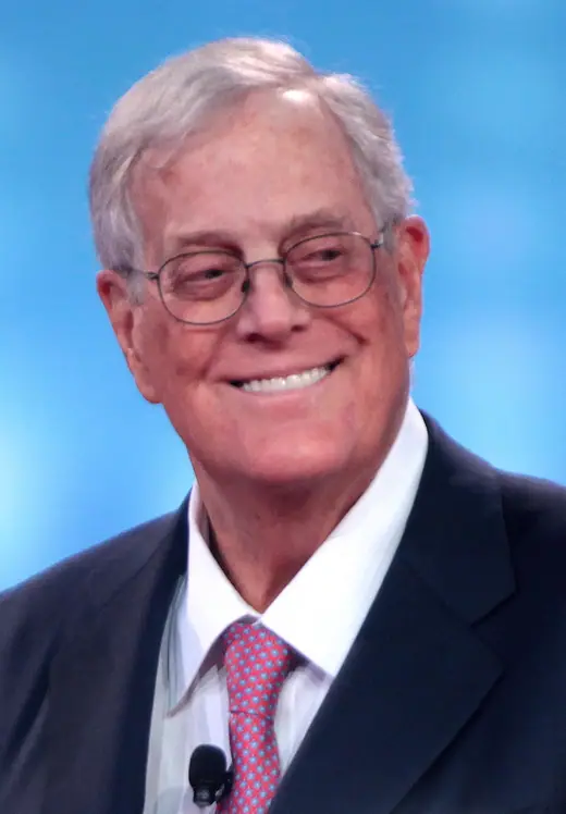 David Koch speaking at a lectern in 2015.