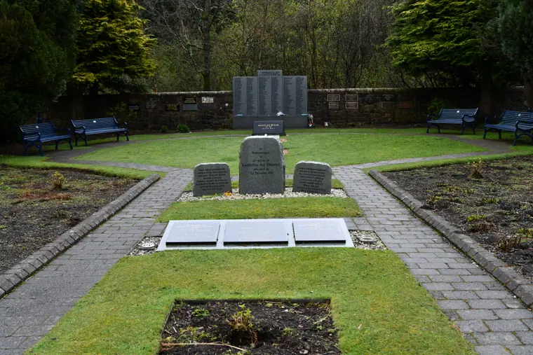 The memorial garden at Dryfesdale, Lockerbie, with its stone wall of remembrance and planted borders.