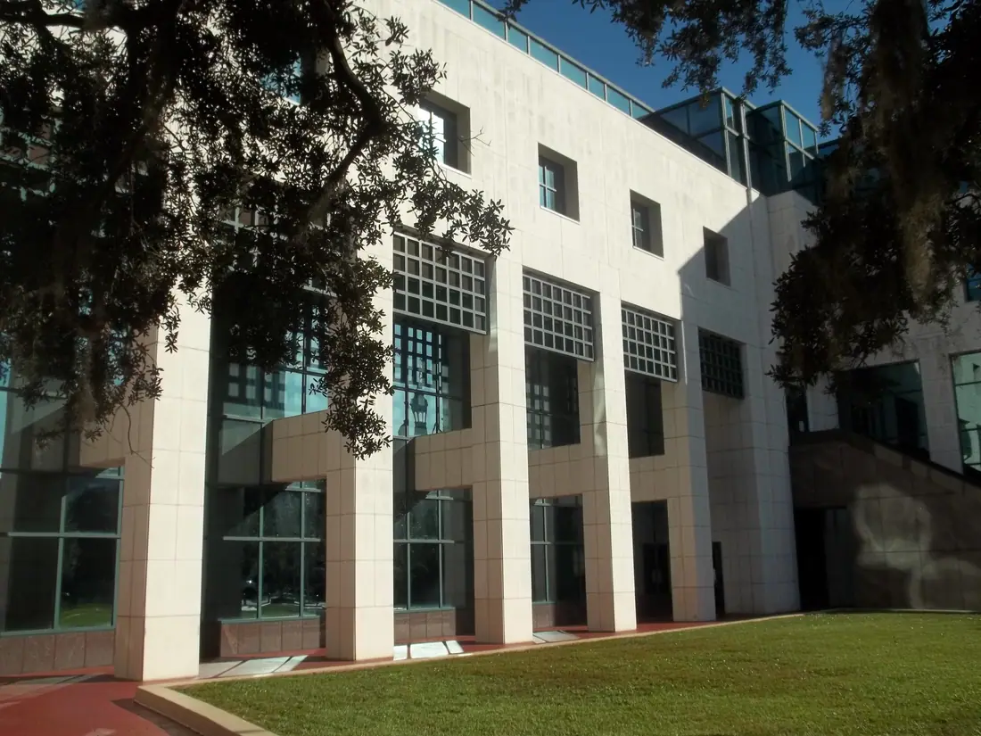The full facade of the Leon County Courthouse in Tallahassee seen across a street.