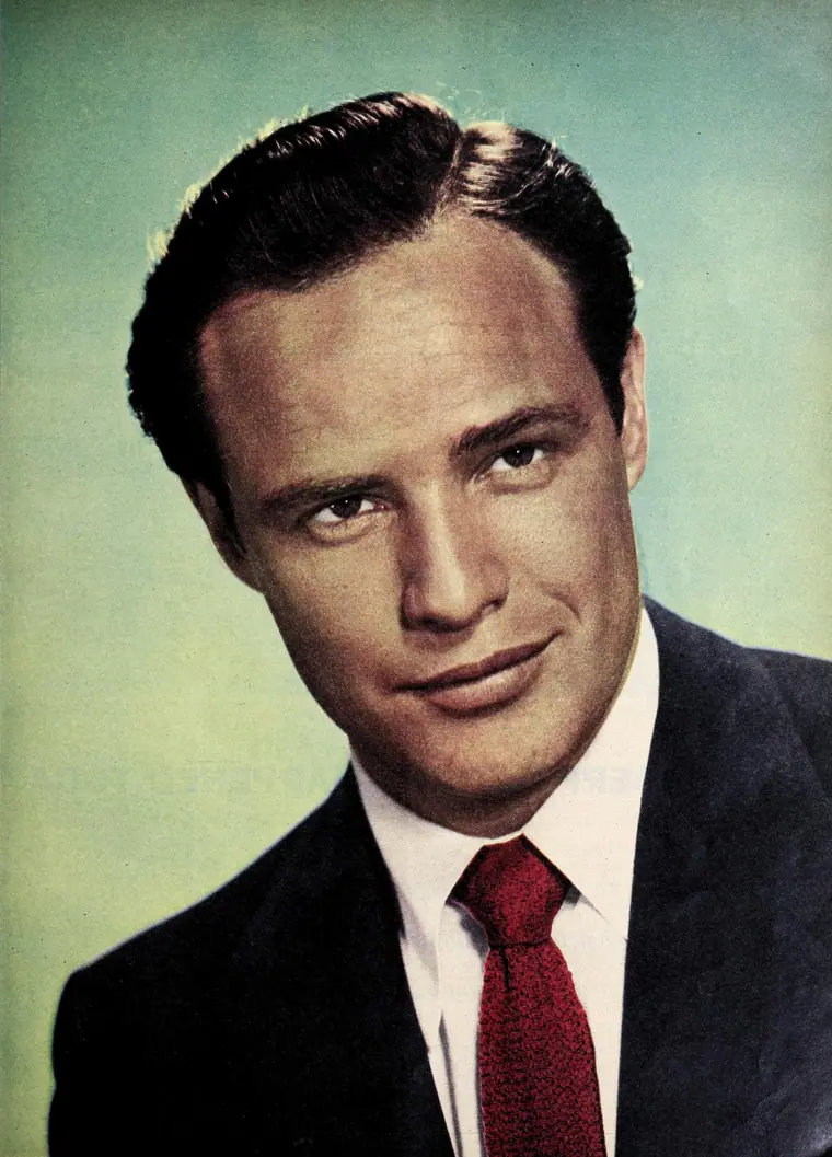 Studio portrait of Marlon Brando published in Photoplay magazine in January 1955.