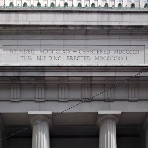 Carved stone inscription reading Mellon National Bank on the Smithfield Street facade.