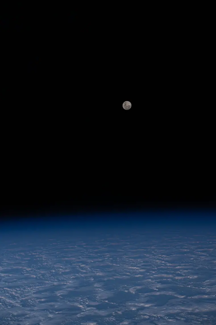 The full moon above a cloud-covered south Indian Ocean, photographed from the International Space Station.