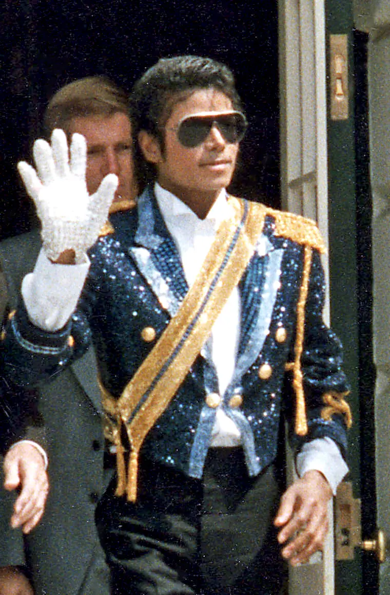 Michael Jackson in a military-style jacket and sunglasses at the White House, May 1984.