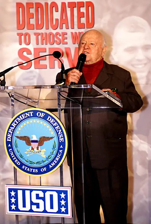 Mickey Rooney speaking at the Pentagon during a corridor dedication ceremony honouring the USO, November 2, 2000.