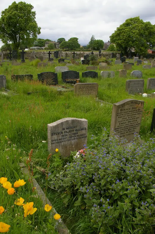 The Plath grave in Heptonstall churchyard, pens and small offerings left at its base.