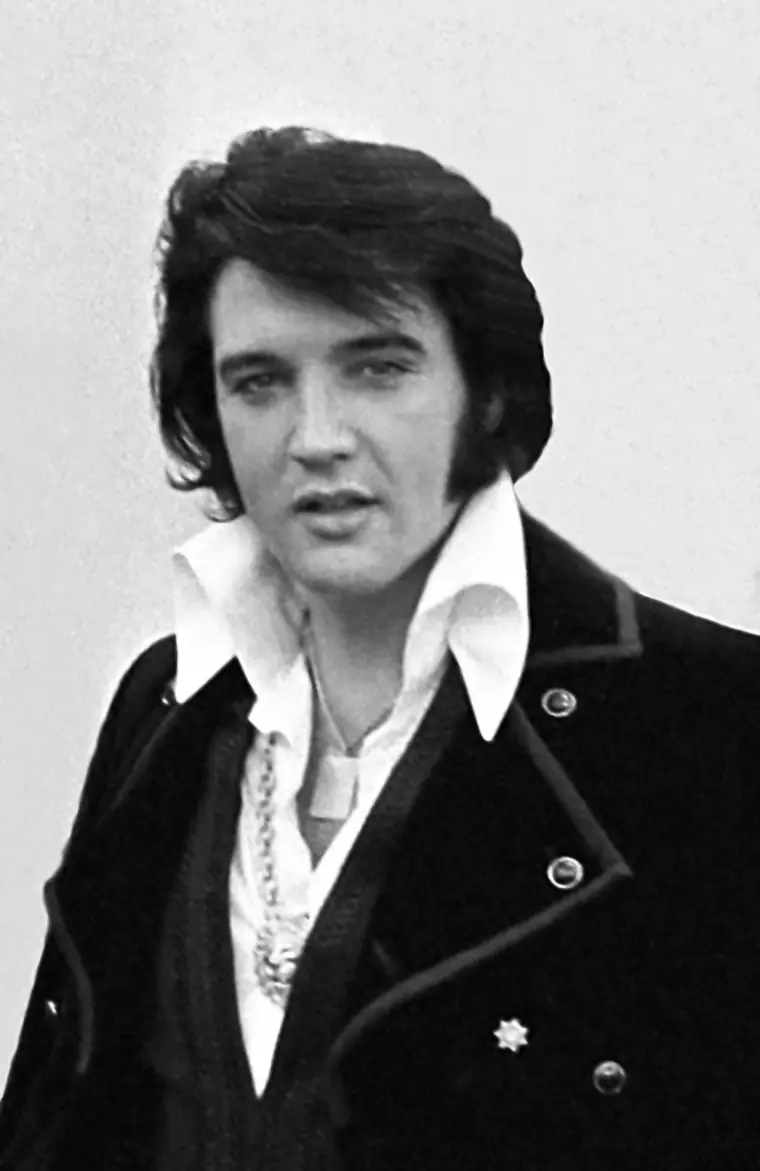 Head-and-shoulders portrait of Elvis Presley in a high-collared jacket, photographed at the White House in December 1970.