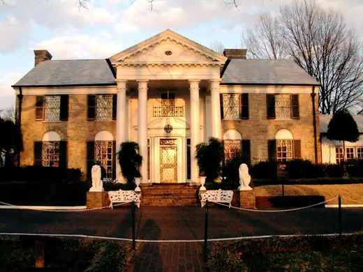 The white-columned front facade of the Graceland mansion in Memphis, Tennessee.