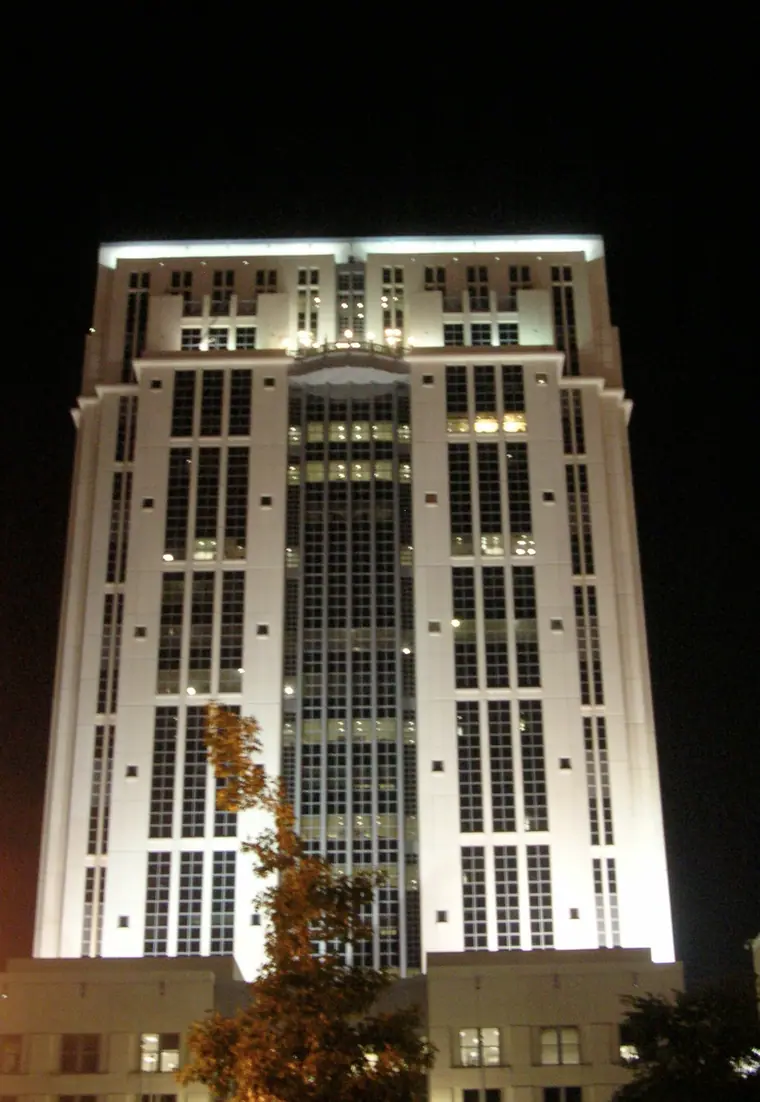 The Orange County Courthouse tower in Orlando, Florida, lit at night.