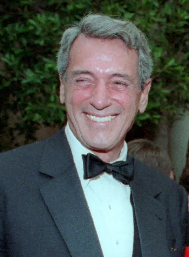 An actor in black tie photographed at a White House event in May 1984.