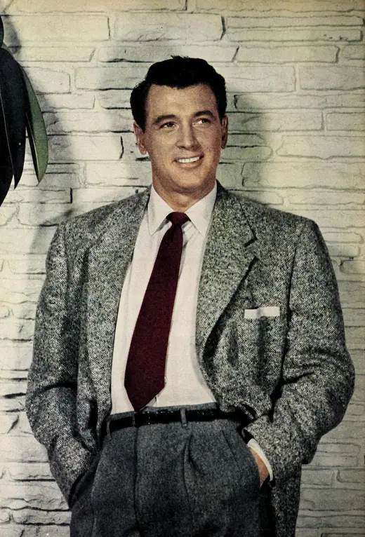 Studio portrait of an actor in a suit, mid-1950s.