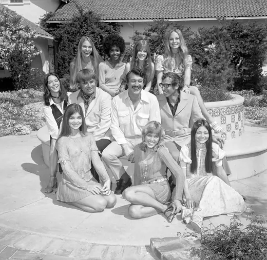 A film cast and its director and producer photographed together in 1970.