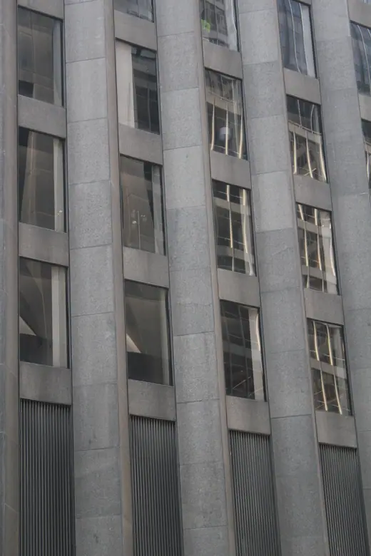 The dark granite CBS Building on West 52nd Street in Manhattan, seen from street level.
