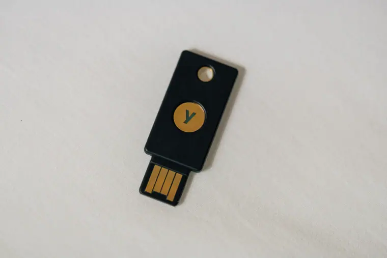 Macro photograph of a USB hardware security token used for two-factor authentication.