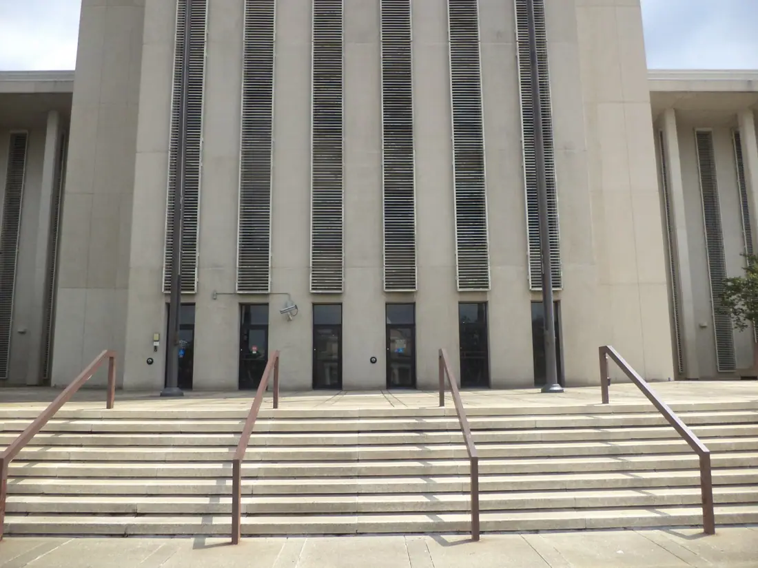 The west face of the Florida State Capitol tower under a clear sky.