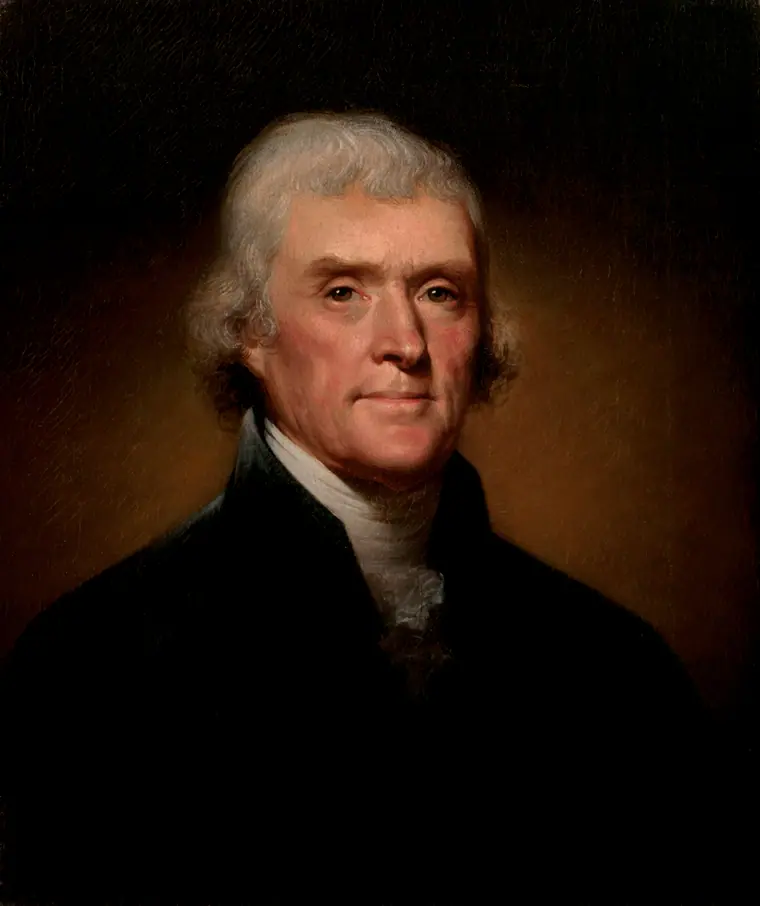 Oil portrait of Thomas Jefferson in a dark coat with a fur collar, turned slightly to his right.