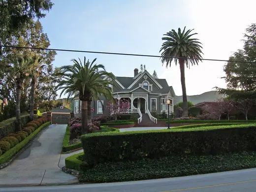 A large Victorian-style house among trees in Monte Sereno, California.