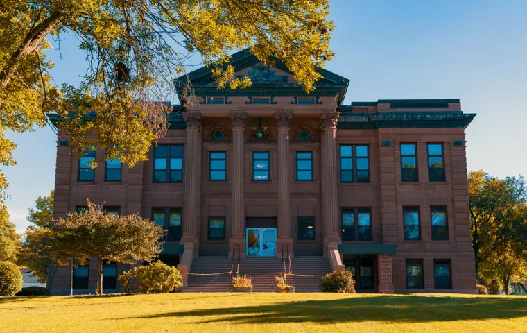 The Plymouth County Courthouse in Le Mars, Iowa, a stone civic building with a central tower.