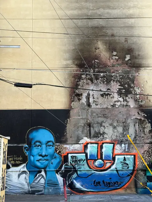 A painted wall mural commemorating Tony Hsieh in the Las Vegas Arts District.