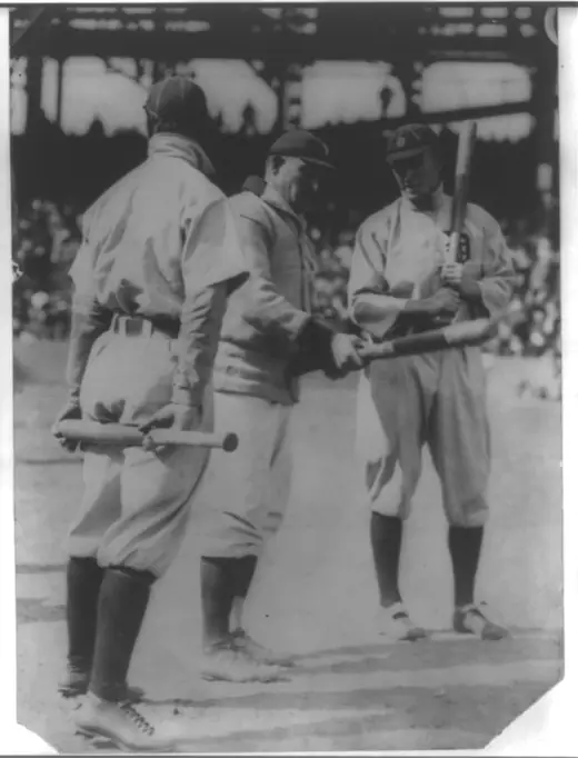 Honus Wagner of Pittsburgh and Ty Cobb of Detroit standing together in uniform before a game.